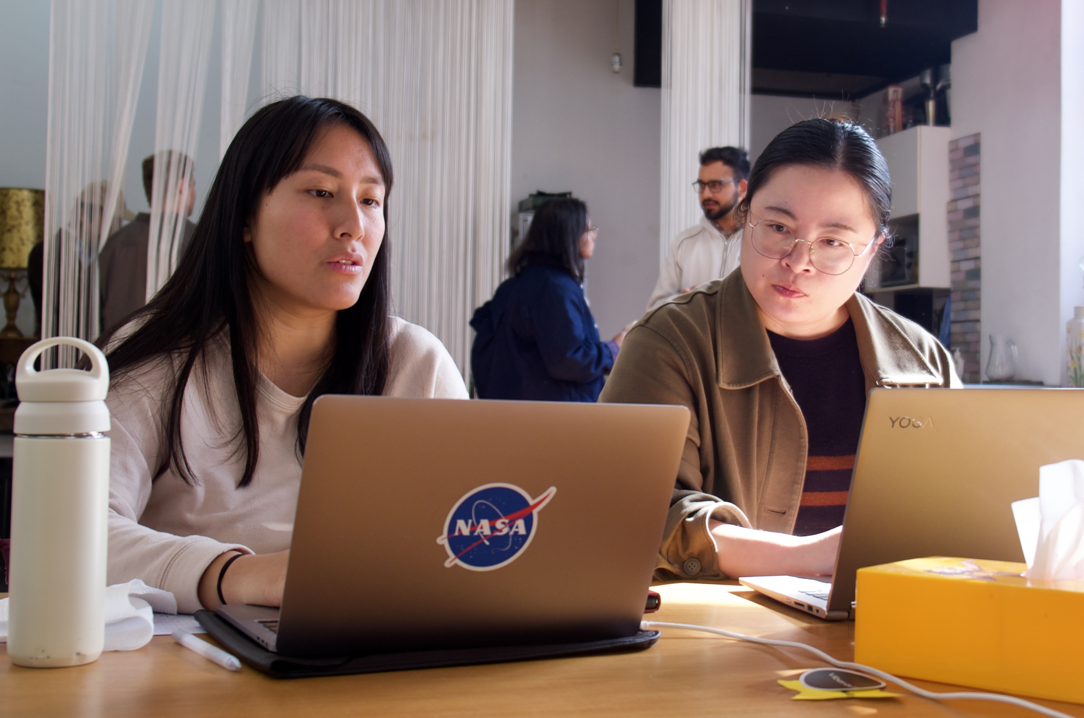 Luna and Yav, founders of BitoPhoto, on set